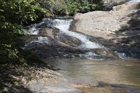 Others call it Peach Bottom Falls. Enjoy fishing the creek or just take a dip at the top. Watch some of the local slide down the falls.